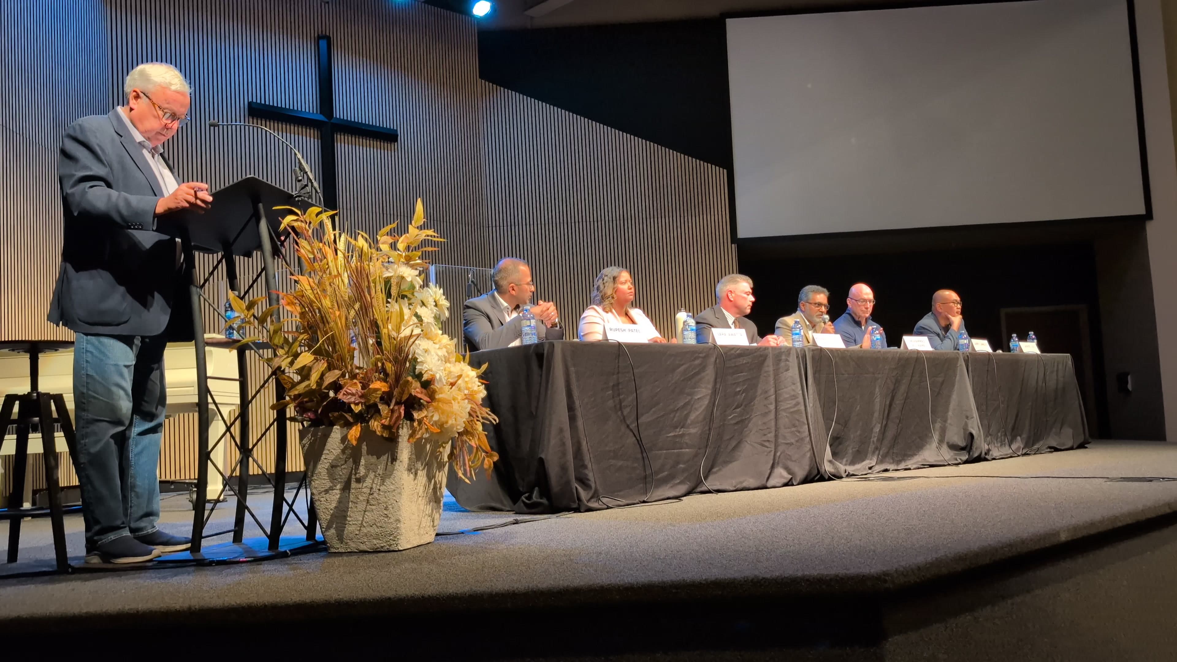 Ali answering question about city accountability at debate