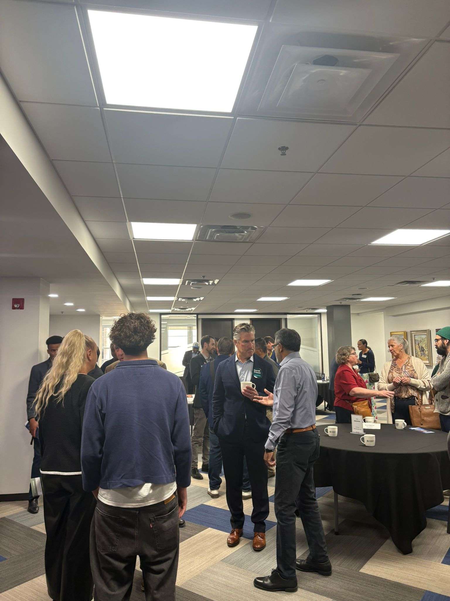 Ali in conversation with attendees at Chamber of Commerce Meet and Greet